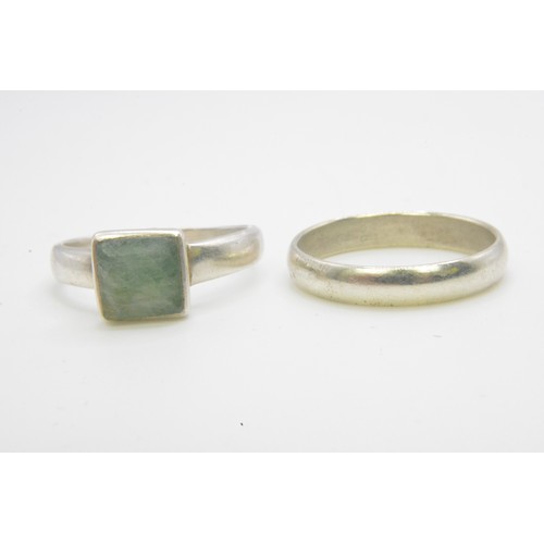 241 - Two silver rings, one with green stone stamped 925