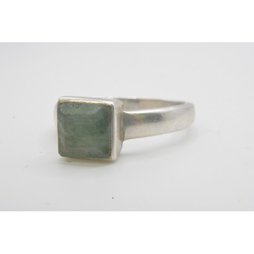 241 - Two silver rings, one with green stone stamped 925