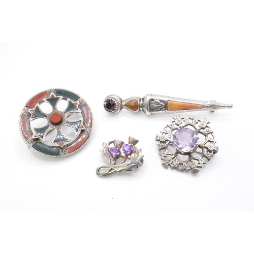 244 - Group of silver brooches, Scottish, to include  Victorian pebble brooch with agate, dirk brooch, thi... 