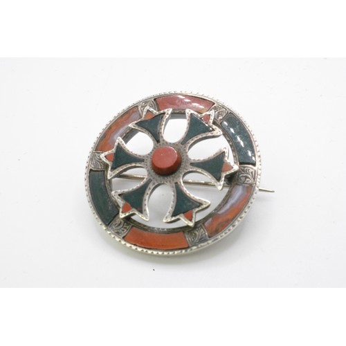 244 - Group of silver brooches, Scottish, to include  Victorian pebble brooch with agate, dirk brooch, thi... 