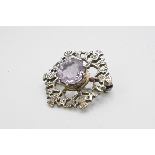 244 - Group of silver brooches, Scottish, to include  Victorian pebble brooch with agate, dirk brooch, thi... 