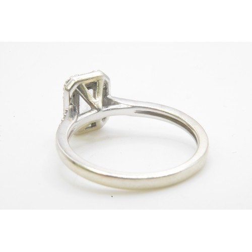 255 - White gold ring, round and rectangle cut diamonds surrounding the central baguette cut stone, diamon... 