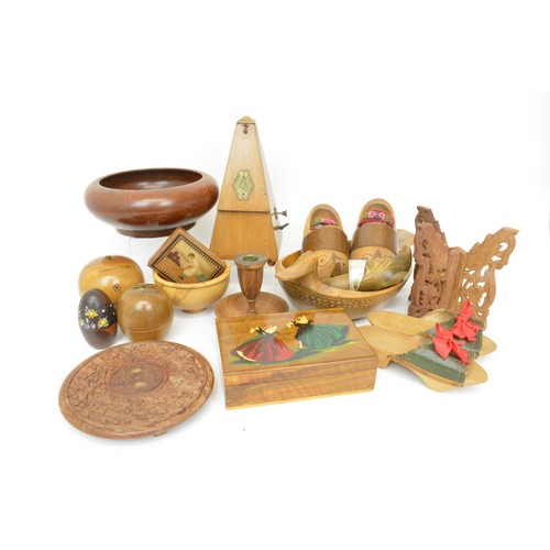 132 - Selection of souvenir treen items to include clogs, candlesticks, boxes, string box, metronome etc.