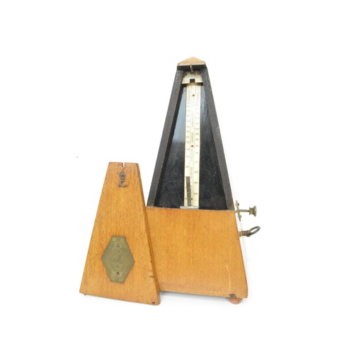132 - Selection of souvenir treen items to include clogs, candlesticks, boxes, string box, metronome etc.