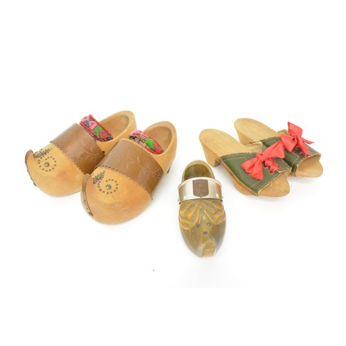 132 - Selection of souvenir treen items to include clogs, candlesticks, boxes, string box, metronome etc.