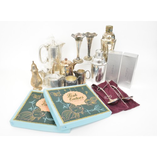 145 - Silver plated group consisting cocktail shakers, candlesticks, tea and fish knives, some new and box... 
