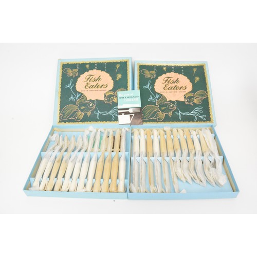 145 - Silver plated group consisting cocktail shakers, candlesticks, tea and fish knives, some new and box... 