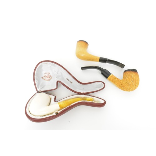 151 - Three  Meerschaum pipes, one in fitted case