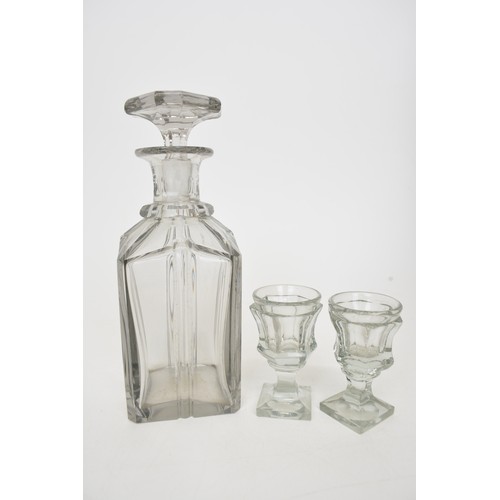 7 - Antique Liqueur Tantalus, ebonised wooden case which opens up to reveal sixteen glasses and  four ca... 