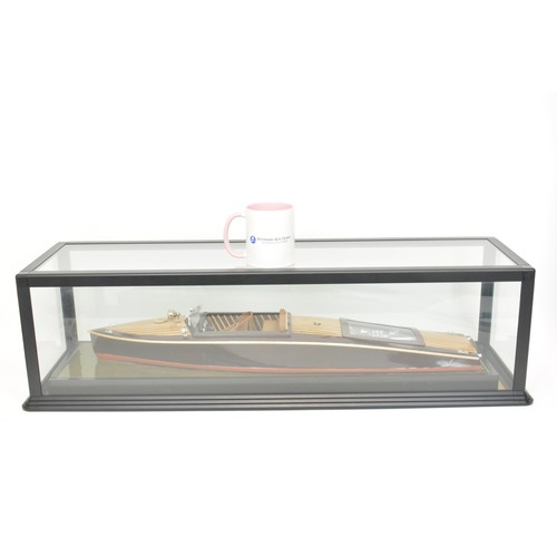 9 - Large model of motorboat, mixed composition of woods, leather seats, with glazed over case. Approx s... 