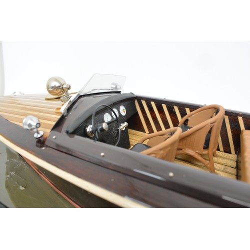 9 - Large model of motorboat, mixed composition of woods, leather seats, with glazed over case. Approx s... 