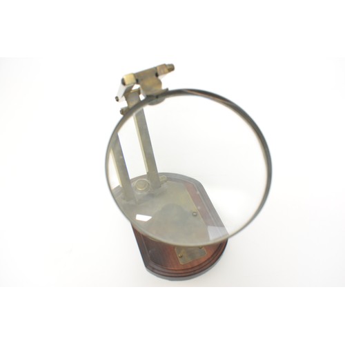 15 - Desktop magnifying glass with adjustable metal mount, bears label 'Watkins & Hill Opticians, London ... 