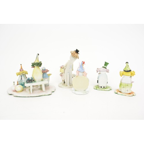 38 - A collection of Italian Zampiva ceramic clown figures, rare model of three piece band, signed to bas... 