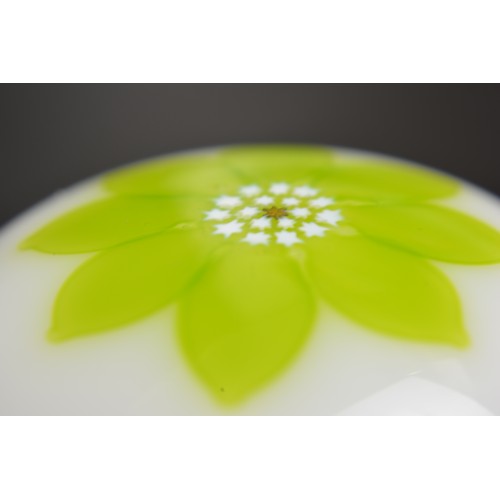 52 - Saint Louis Crystal, France - A white opaline  paperweight  with a zesty green flower petal bloom