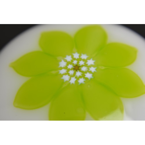 52 - Saint Louis Crystal, France - A white opaline  paperweight  with a zesty green flower petal bloom
