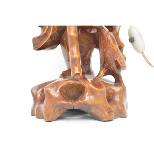 59 - A pair of oriental lamps, carved form of elder holding staff. Untested AF.