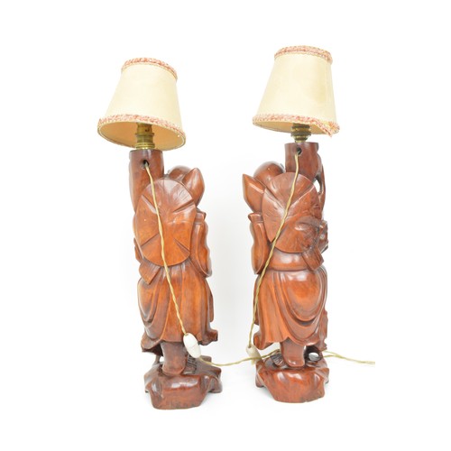 59 - A pair of oriental lamps, carved form of elder holding staff. Untested AF.