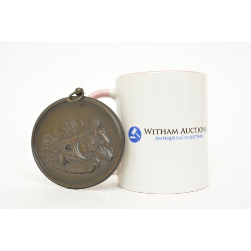 37 - Bronze oval medallion, depicting maiden along waters edge with fish