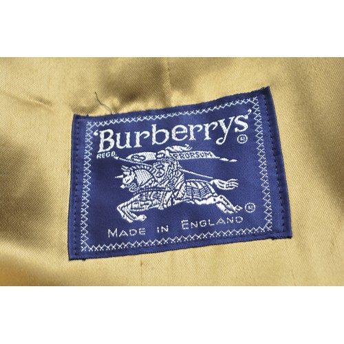 95 - Burberrys Mac with check lining, 48