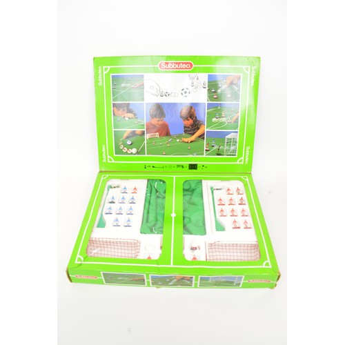 104 - Boxed Subbuteo sets together with x6 Premier League teams, a Scotland World Cup, score board, goals,... 