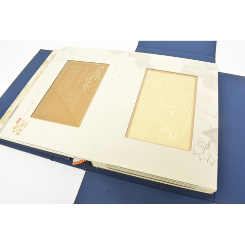 114 - Chinese family tradition presentation book, limited edition set of Ag 990 silver cards. Gold award w... 