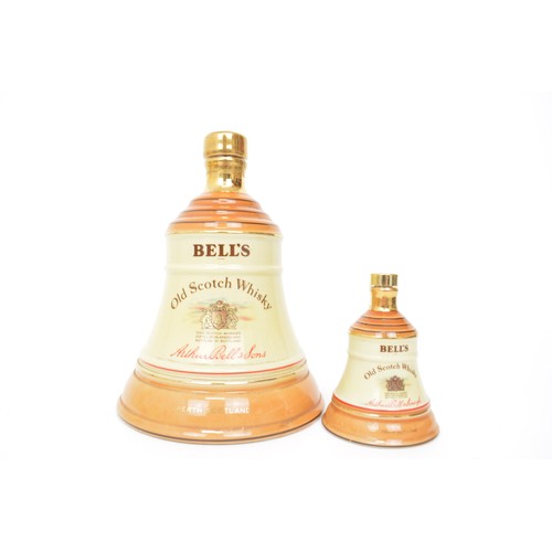 117 - A large collection of Wade ceramic Scotch Whisky decanters - Bells and Famous Grouse.  Plus Whyte an... 