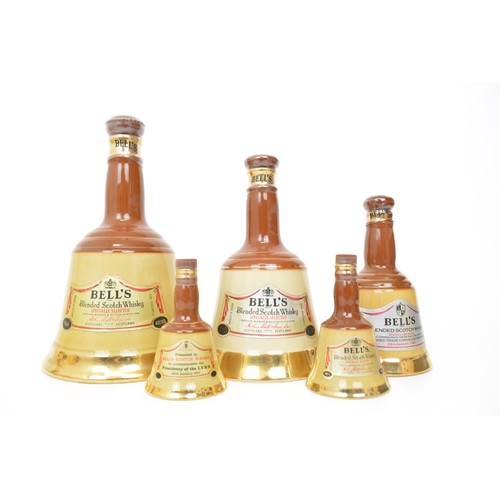117 - A large collection of Wade ceramic Scotch Whisky decanters - Bells and Famous Grouse.  Plus Whyte an... 