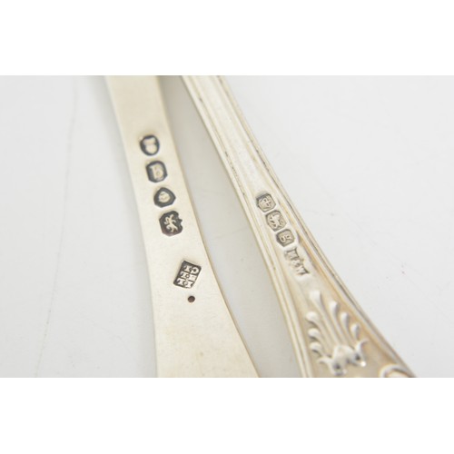 224 - Collection of Georgian silver dessert spoons and ladles, approx gross weight 462g.