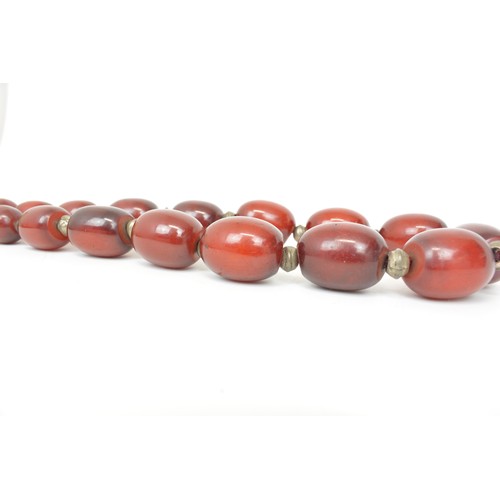 232 - Vintage heavy set beaded necklace. Possibly middle eastern mixed composite resin Faturan, Approx wei... 