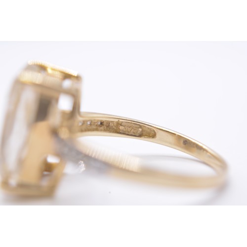 258 - 9ct yellow gold ring with golden rutilated quartz and diamonds, marked 375, approx size P