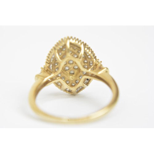 261 - Yellow gold Baguette and round cut diamond ring in marquise design with accent diamonds to shoulder,... 