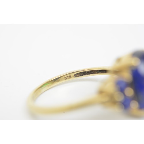 270 - Lapis Lazuli 9ct yellow gold ring, cabochon oval central stone with four round stones, approx size P... 