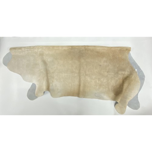 57 - Large full cow Hide rug, label reads 2,74m2