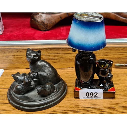 92 - Black Cat Collection, Two black Cats with red top ears sitting beside a table light which is a table... 