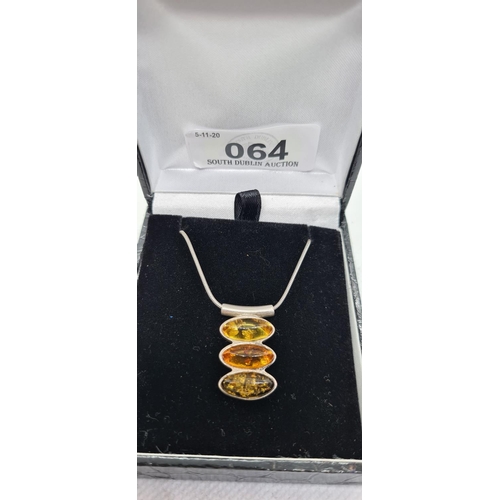64 - Sterling Silver and Amber necklace.
