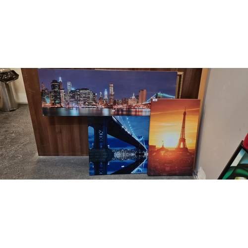 312 - 3 unframed canvas prints. Paris, New York x 2