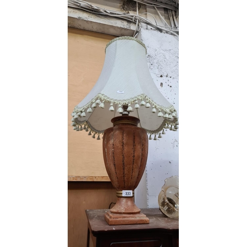 333 - Large Terracotta lamp with a cream shade.
