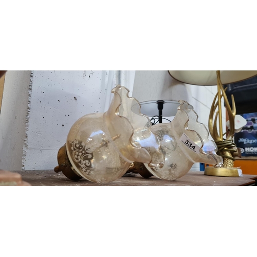 334 - Pair of Brass and glass vintage wall lights.