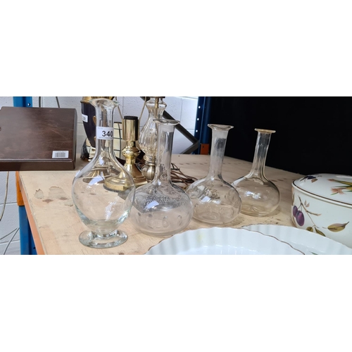 340 - 4  antique glass decanters, 3 matching all hand blown.