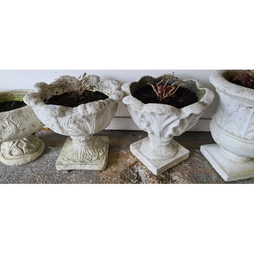 10 - Pair of large heavy shell garden urn planters.