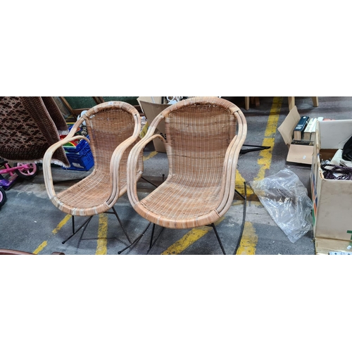 356 - Pair of Rattan and cast metal vintage rocking chairs