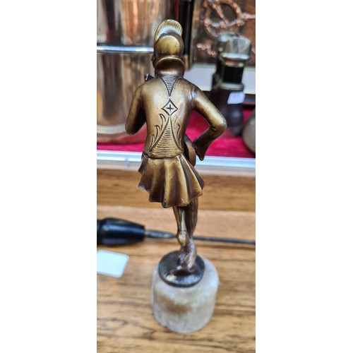 155 - Art deco period of a lady playing an instrument either heavy bronze or brass.