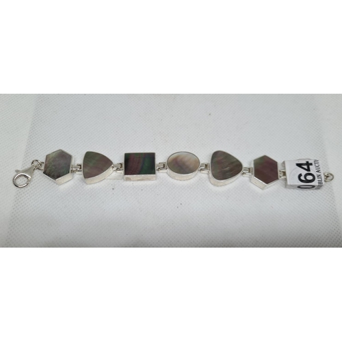 64 - Sterling Silver bracelet with mother of pearl type stones. Large and impressive.