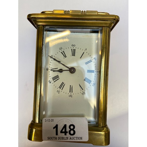 148 - Heavy Antiqgue mechanical carriage clock. Glass sides and back with key.