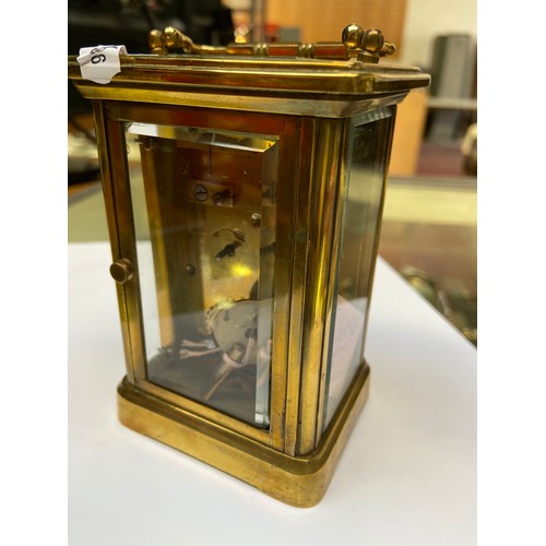 148 - Heavy Antiqgue mechanical carriage clock. Glass sides and back with key.