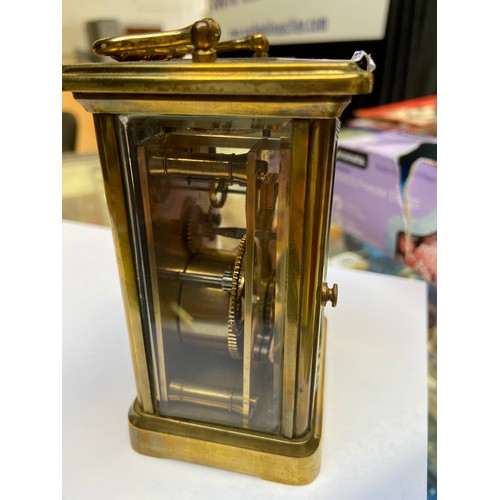 148 - Heavy Antiqgue mechanical carriage clock. Glass sides and back with key.