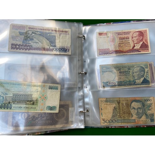 336 - Fairly full album of world bank notes and coins.