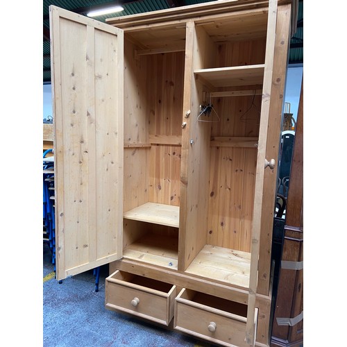 584 - Super stripped pine Double wardrobe with two drawer base. Very Good quality example.