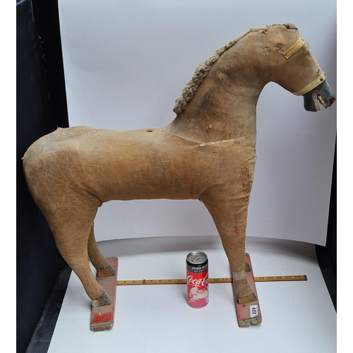 229 - 19th century leather horse on a wooden stand.