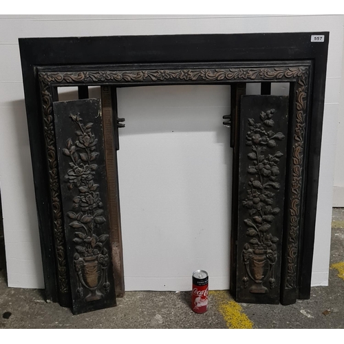 557 - Cast metal Fire place.